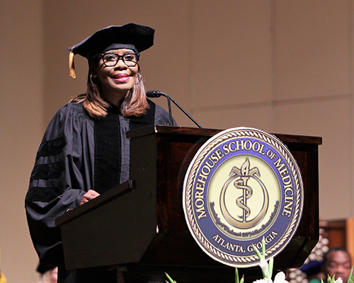 Dr. Patrice Harris standing at a lectern